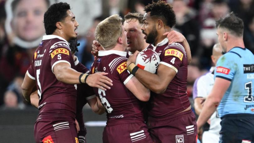 The Maroons' HamisoTabuai-Fidow (right) scored a try but was also injured during Origin II.  (Joel Carrett/AAP PHOTOS)