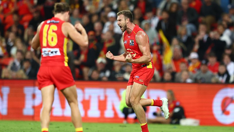 Sam Day of the Suns celebrates a goal.