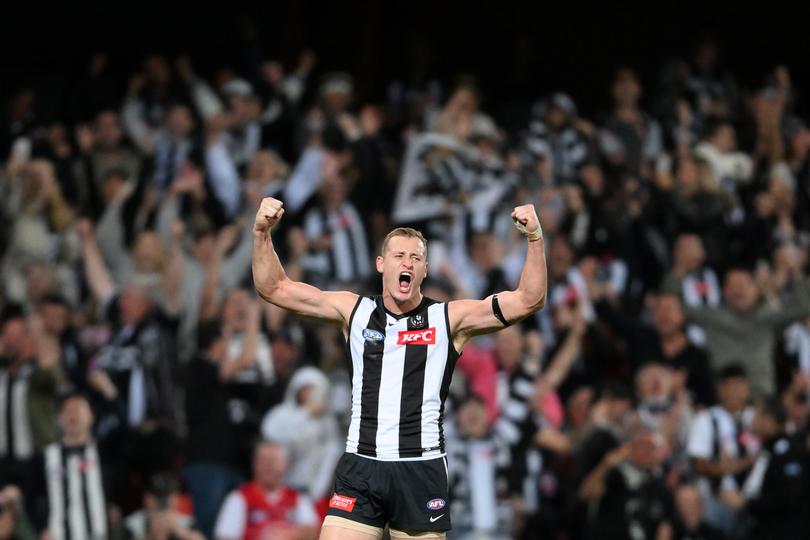 Nathan Kreuger celebrates as he puts the Pies in front.