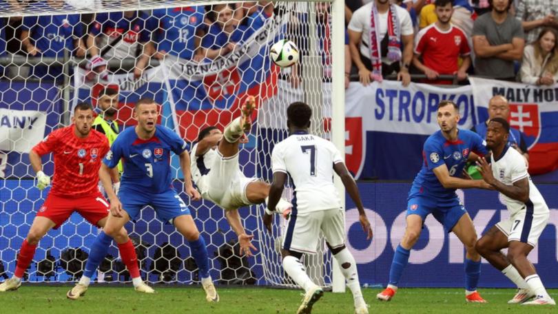 Jude Bellingham (centre) rescued England with a spectacular overhead equaliser against Slovakia. (EPA PHOTO)