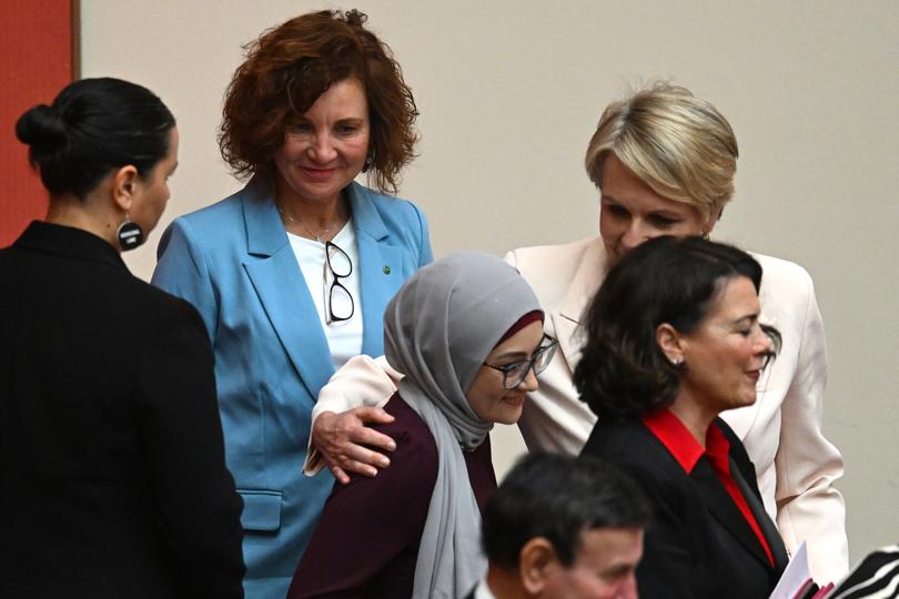 Labor Senator Fatima Payman is embraced by Australian Environment Minister Tanya Plibersek during the swearing in ceremony of Governor-General of Australia Sam Mostyn in the Senate chamber at Parliament House in Canberra, Monday, July 1, 2024. (AAP Image/Lukas Coch) NO ARCHIVING