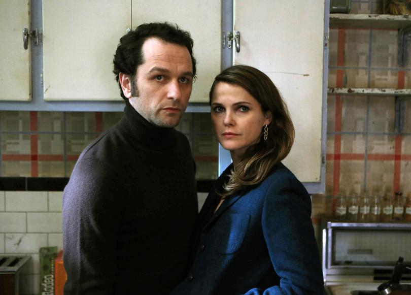 In this image released by FX, Matthew Rhys, left, and Keri Russell appear in a scene from "The Americans." On Thursday, July 14, 2016, Rhys was nominated for outstanding actor in a drama series for his role in the series. The 68th Primetime Emmy Awards will be broadcast live Sunday on ABC beginning at 8 p.m. ET on ABC. (Craig Blankenhorn/FX via AP)
