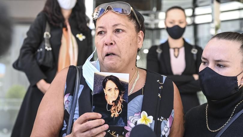 Amy Wensley's mother Nancy Kirk holds a photo of her daughter. 