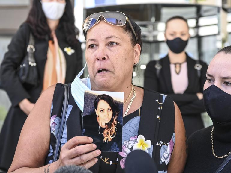 Amy Wensley's mother Nancy Kirk holds a photo of her daughter. 