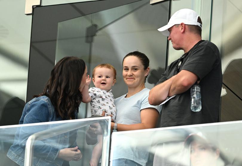 Barty (centre) is seen with her baby Hayden.