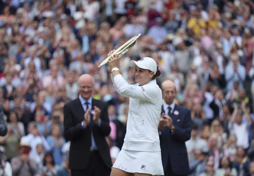 Barty holds the victory trophy at Wimbledon in 2021.