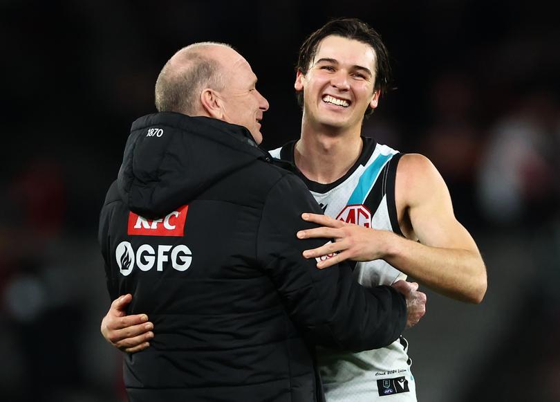 Ken Hinkley and Connor Rozee of the Power celebrate winning against St Kilda by two points.