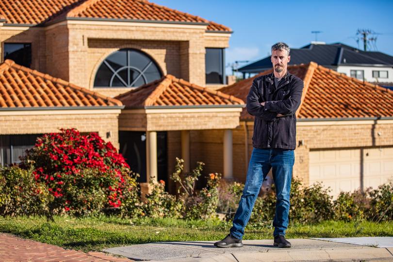 Ben Robbins out the front of 5 Hillcrest Street, his family's former address. 