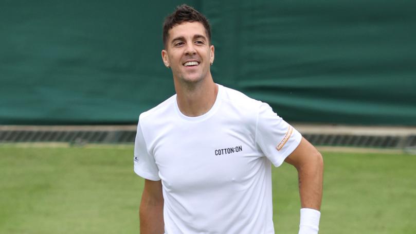 Thanasi Kokkinakis celebrates winning match point against Felix Auger-Aliassime of Canada.