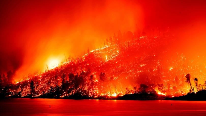 The Thompson Fire burns above Lake Oroville in Oroville, Calif., Tuesday, July 2, 2024. (AP Photo/Noah Berger) Noah Berger