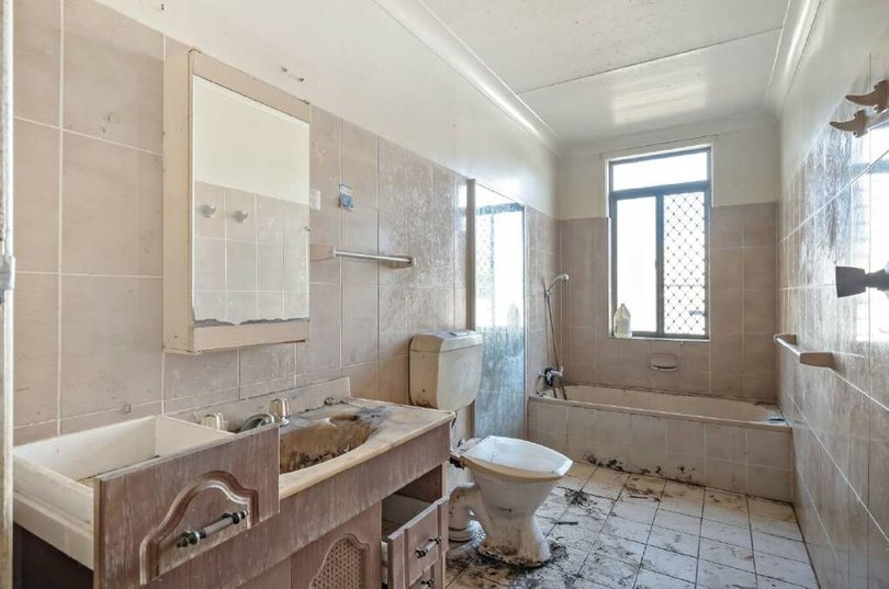 The bathroom requires a full renovation.