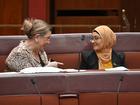 Independant Senator Tammy Tyrrell speaks to former Labor Senator Fatima Payman sitting on the crossbench during Question Time in the Senate chamber at Parliament House in Canberra, Thursday, July 4, 2024. (AAP Image/Mick Tsikas) NO ARCHIVING