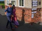 British Prime Minister Rishi Sunak and his wife Akshata Murty arrive to cast their votes during the general election at Kirby Sigston Village Hall.