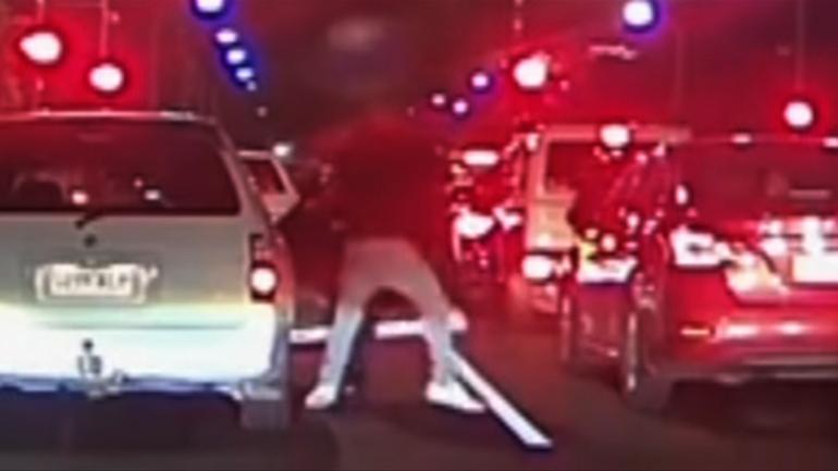 Two Adelaide drivers were filmed getting out of their cars and trading blows in an apparent road rage incident.