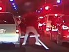 Two Adelaide drivers were filmed getting out of their cars and trading blows in an apparent road rage incident.