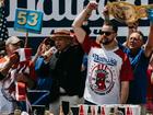Patrick Bertoletti (C) is declared the winner of the annual Fourth of July Hot Dog Eating Contest. (EPA PHOTO)