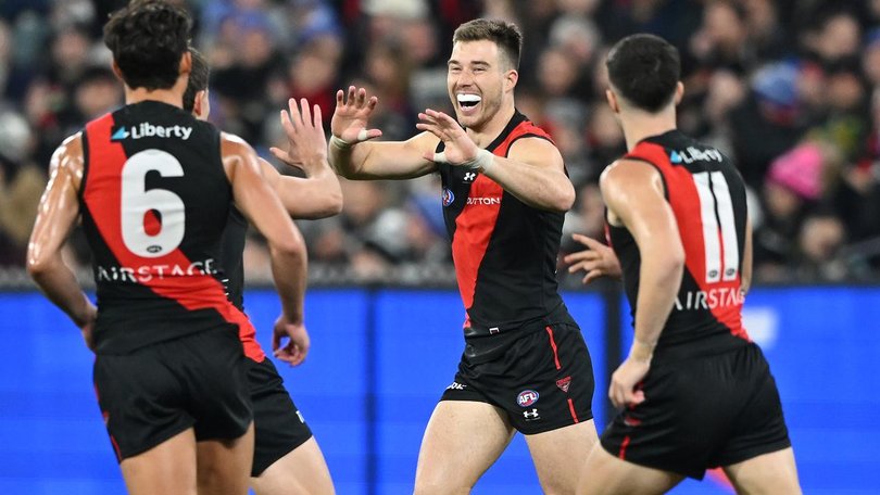 Zach Merrett (centre) led from the front in Essendon's 12-point win over Collingwood. (James Ross/AAP PHOTOS)