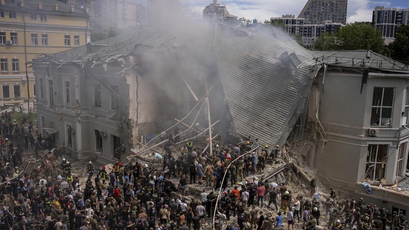 Hundreds of Kyiv residents have helped to clear debris after a hospital was struck by a missile.