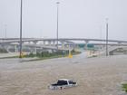 A vehicle is left abandoned in floodwater on a Houston highway after Hurricane Beryl swept through the area.