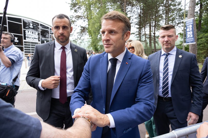 LE TOUQUET-PARIS-PLAGE, FRANCE - JUNE 30: French President Emmanuel Macron greet members of the public before leaving a voting station on June 30, 2024 in Le Touquet-Paris-Plage, France. Today is the first round of legislative elections, with the second vote being held on July 7. The snap election was called by President Macron in response to his party's defeat in the European elections earlier this month. (Photo by Sébastien Courdji/Getty Images)