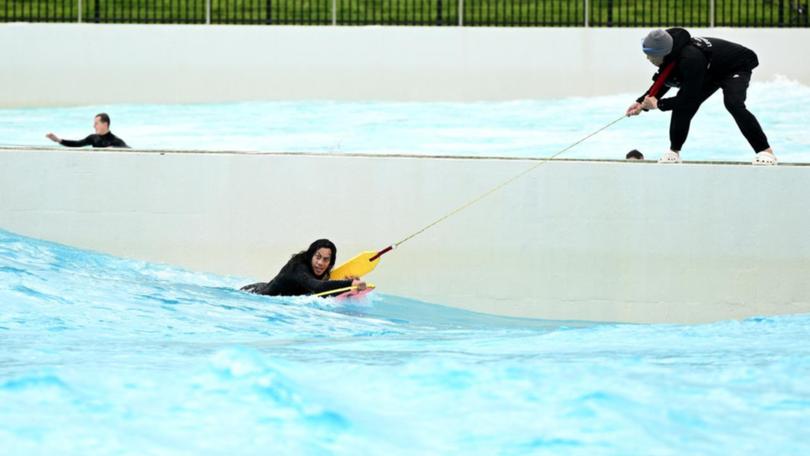 Jarome Luai needed a helping hand when he found himself in troubled waters in a wave pool. (Dan Himbrechts/AAP PHOTOS)