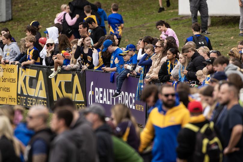 Fans attend Eagles training on Tuesday. 