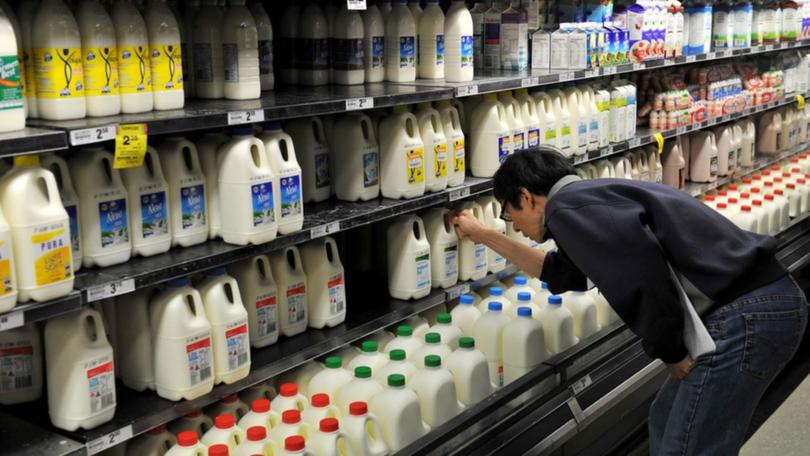 The Queensland Greens have proposed a price cap on basic essential grocery items such as milk. (Paul Miller/AAP PHOTOS)