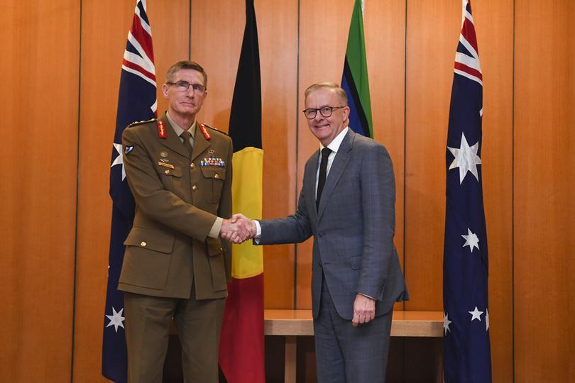 Australian Prime Minister Anthony Albanese shakes hands with Chief of the Australian Defence Force Angus Campbell during a meeting at Parliament House in Canberra, Monday, May 30, 2022. (AAP Image/Lukas Coch) NO ARCHIVING