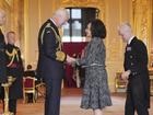 Shirley Bassey grabbed the King's hands "because I forgot to curtsy" at her investiture. (AP PHOTO)