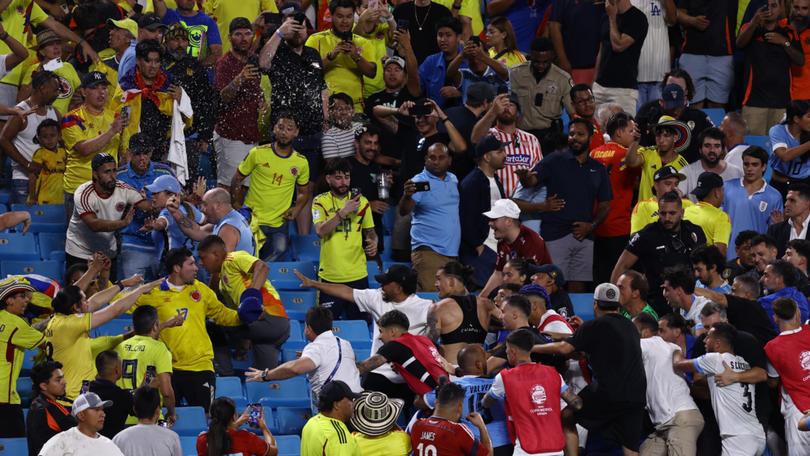  Darwin Nuñez  of Uruguay climbs into the stands during the  Copa America 2024 semifinal match between Uruguay and Colombia at Bank of America Stadium on July 10, 2024 in Charlotte, North Carolina. (Photo by Tim Nwachukwu/Getty Images)