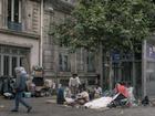 Homeless people on a sidewalk by City Hall in Paris on July 1.