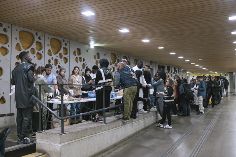 A line for a free meal at a train station in Orlans, France, about a two-hour bus ride southwest of Paris.