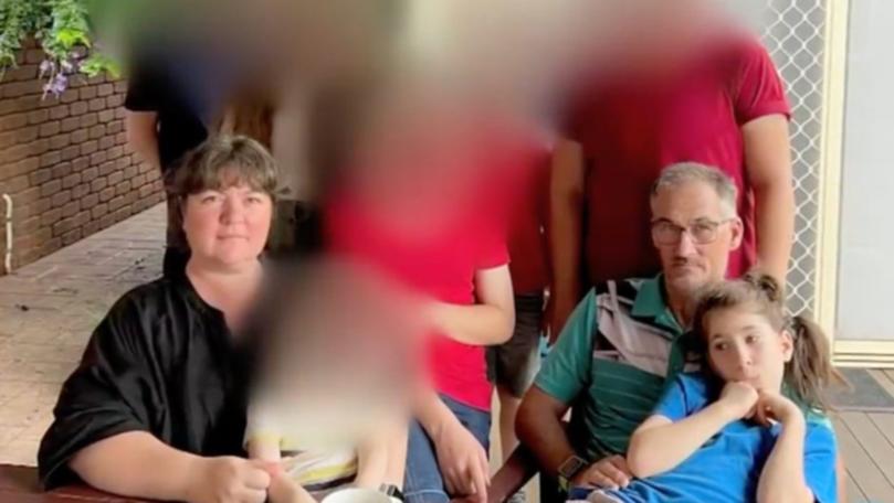 Kerrie Elizabeth Struhs (left) and Jason Richard Struhs with Elizabeth Struhs on his lap.