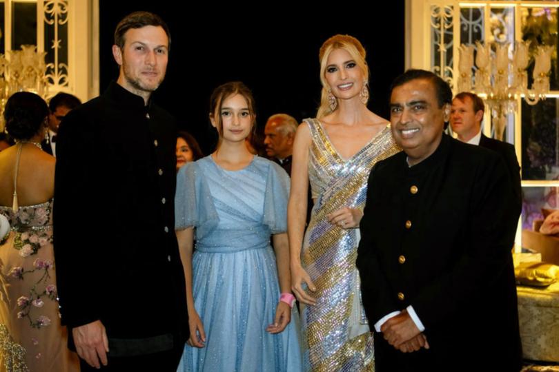 Jared Kushner, daughter Arabella and Ivanka Trump pose for a photograph with billionaire industrialist Mukesh Ambani, right.