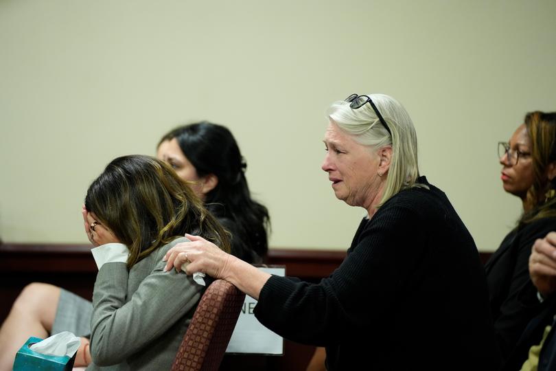 Hilaria Baldwin, left, wife of actor Alec Baldwin, and his sister Elizabeth Keuchler react to the news. 