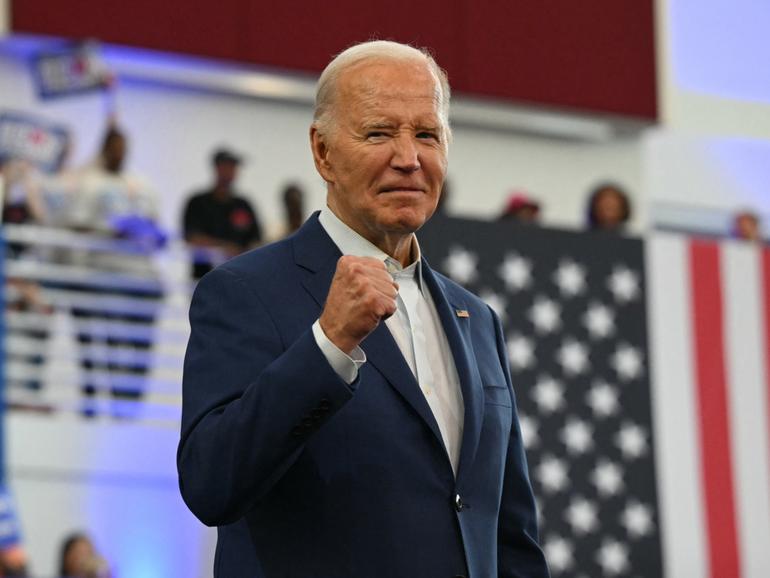 A fired up President Joe Biden arrives to speak during a campaign event at Renaissance High School in Detroit.