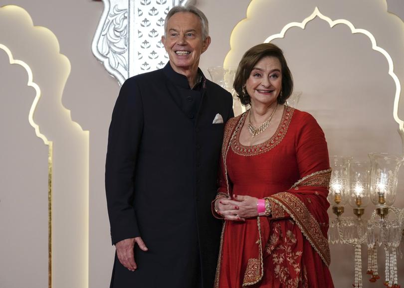 Former British Prime Minister Tony Blair poses for a photograph with his wife Cherie Blair at the wedding.