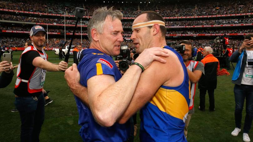 Adam Simpson and former captain Shannon Hurn embrace after the 2018 Toyota AFL Grand Final match between the West Coast Eagles and the Collingwood Magpies at the Melbourne Cricket Ground on September 29, 2018.