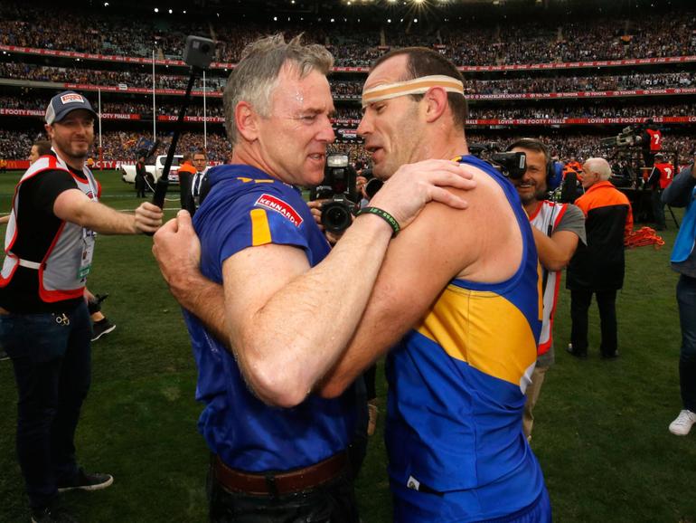 Adam Simpson and former captain Shannon Hurn embrace after the 2018 Toyota AFL Grand Final match between the West Coast Eagles and the Collingwood Magpies at the Melbourne Cricket Ground on September 29, 2018.