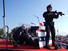 Republican presidential candidate former President Donald Trump is covered by U.S. Secret Service agents at a campaign rally.