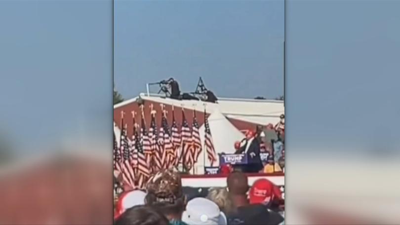 Counter-snipers are seen on a roof over Trump’s right shoulder.