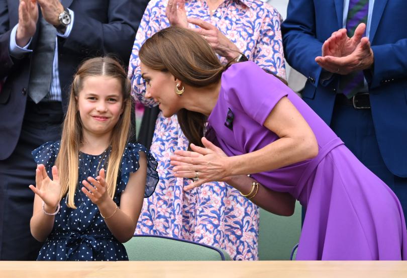 In one snap, Kate leans down to talk to her smiling daughter Princess Charlotte as they watch tennis icons Novak Djokovic of Serbia and Carlos Alcaraz of Spain go head to head.