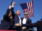 Republican presidential candidate former President Donald Trump is surrounded by U.S. Secret Service agents at a campaign rally, Saturday, July 13, 2024, in Butler, Pa. (AP Photo/Evan Vucci)