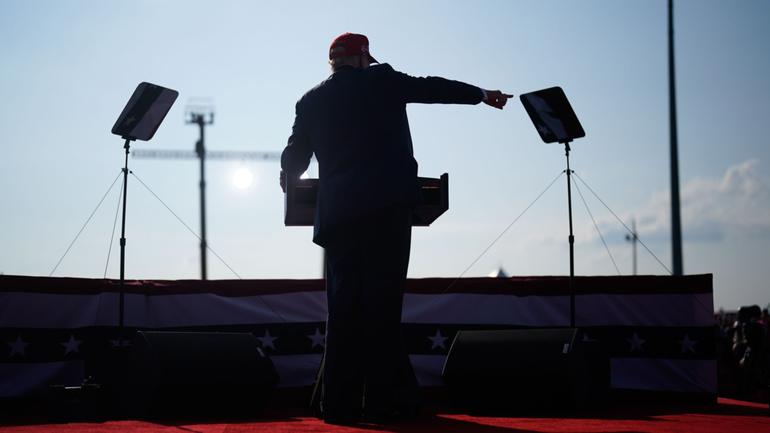 Former president Donald Trump speaks during a campaign rally in Butler, Pa., on Saturday. Trump ducked and was taken offstage after gunshots were heard during his speech.