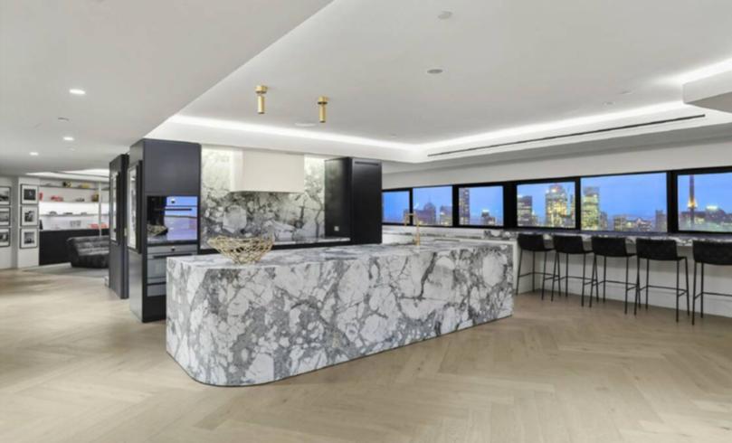 The open-plan kitchen, which also features a butlers pantry, there are Cote D'Azur marble benchtops.