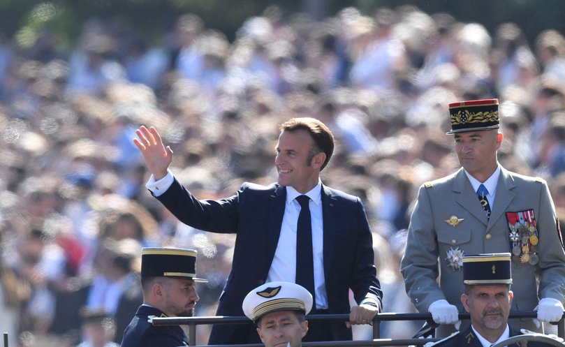 French President Emmanuel Macron and French Chief of the Defence Staff Thierry Burkhard in the command car during the Bastille Day parade.