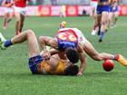 PERTH, AUSTRALIA - JULY 14: Liam Duggan of the Eagles is tackled by Charlie Cameron of the Lions during the 2024 AFL Round 18 match between the West Coast Eagles and the Brisbane Lions at Optus Stadium on July 14, 2024 in Perth, Australia. (Photo by Will Russell/AFL Photos via Getty Images)