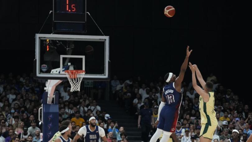 Bam Adebayo tries to block as Boomers' Dante Exum shoots in the Olympic warm-up against the US.