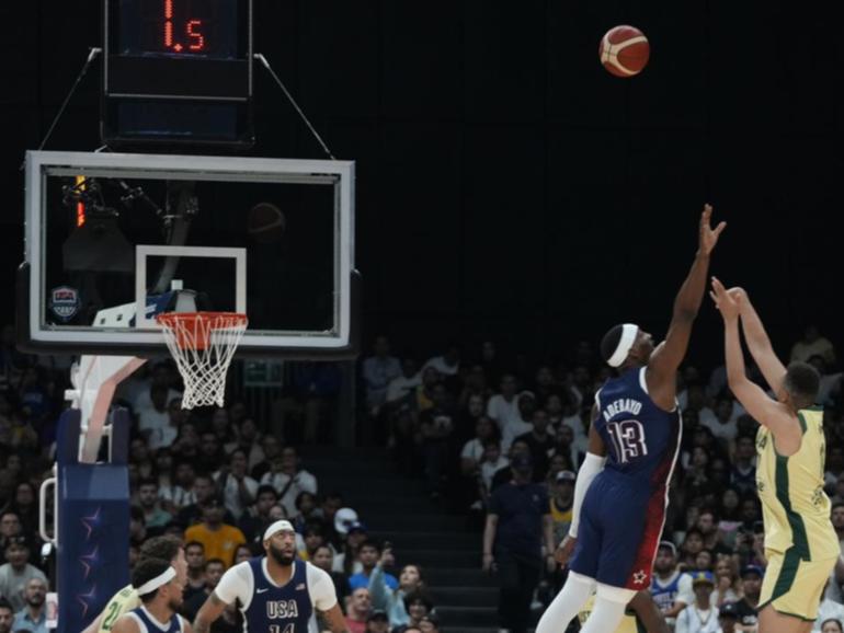 Bam Adebayo tries to block as Boomers' Dante Exum shoots in the Olympic warm-up against the US.