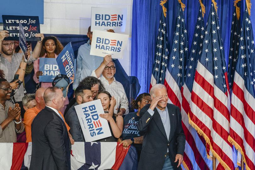 Joe Biden waves goodbye to a crowd during a campaign stop.